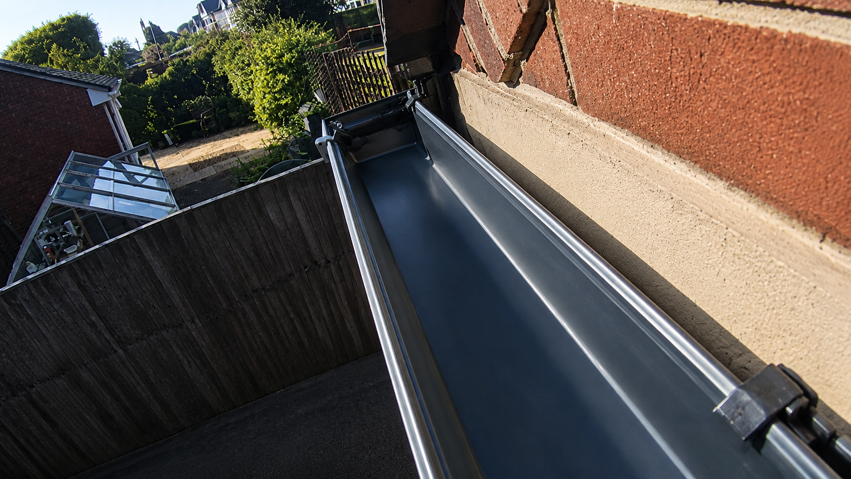 After gutter cleaning — clear system following professional summer clean